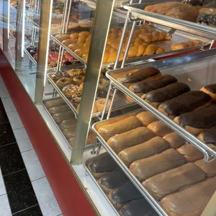 a bakery display case filled with donuts
