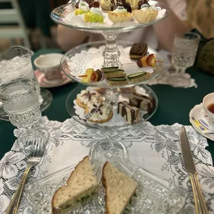 Afternoon Tea service with finger sandwiches, fruit and bite sized sweets.