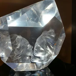 An amazing glass sculpture that changes appearance as you walk around the sculpture because of the way the glass is cut.