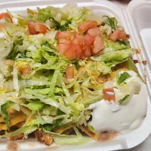 a salad in a styrofoam container