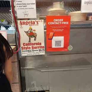 a woman standing in front of a counter