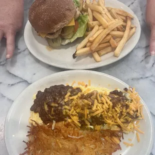 Mexican omelette and grilled chicken with fries.