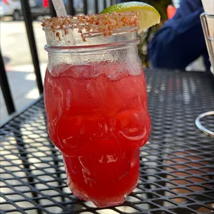 Strawberry margarita half drank