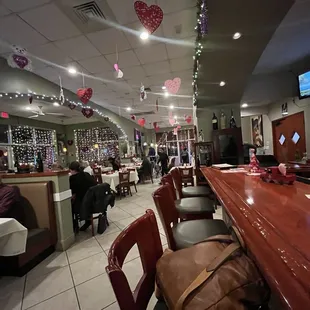 people sitting at tables in a restaurant