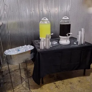 a table with a beverage dispenser