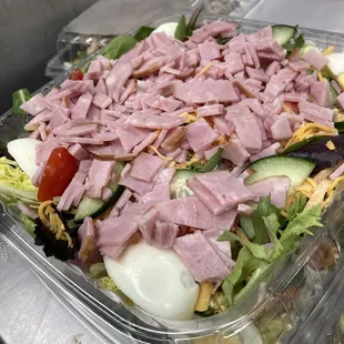 a salad in a plastic container
