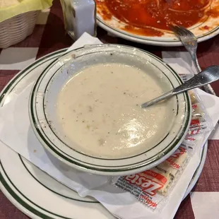 a bowl of soup and a plate of pizza