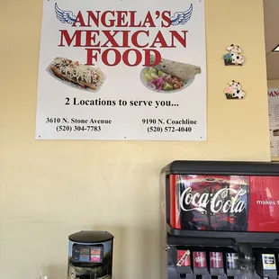 a sign above a vending machine