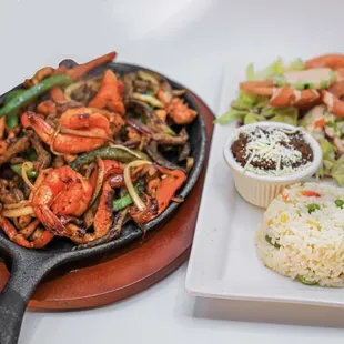 a plate of shrimp and rice