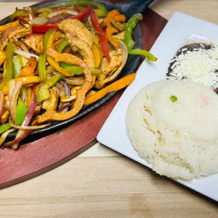 a plate of chicken and rice