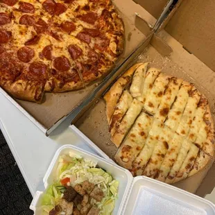 two pizzas and a salad