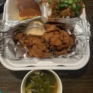 Two piece chicken with rice, collard greens and corn bread