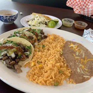 Fat carne asada street tacos, rice and beans and asada Gordita