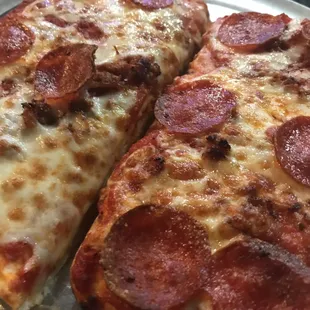 two slices of pepperoni pizza