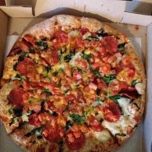 White spinach pizza with pepperoni.