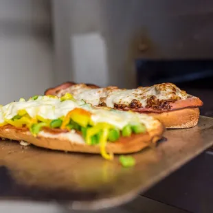 a hot dog with cheese and lettuce