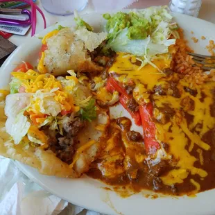 Omg the number one, two puffy tacos, two enchiladas rice bean guacamole all for 8.00 wow