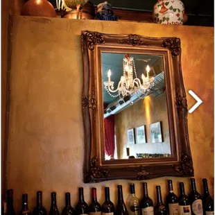 a chandelier and wine bottles