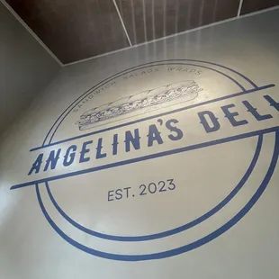 the logo on the wall