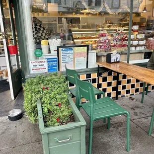 green chairs and tables outside