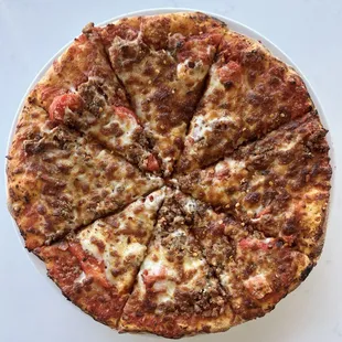 Spicy Sausage Pizza | Spicy arrabbiata sauce, crumbled Italian sausage, roasted red pepper, mozzarella cheese &amp; crushed red pepper.