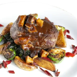 FILETTO MANZO AI FUNGHI with 8 oz. Beef tenderloin, mushroom and demi sauce, roasted potatoes, Brussels sprouts &amp; red chard