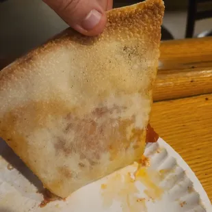 a piece of pizza on a paper plate