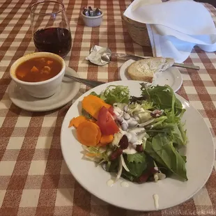 Glass of pinot noir and the dinner entrees come with soup and salad.