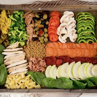 a variety of vegetables in a wooden box