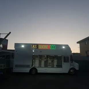 a taco truck parked in a parking lot