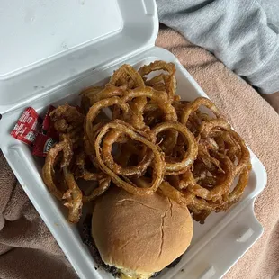 onion rings in a styrofoam container