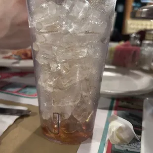 Full cup of ice and they are charging for refills