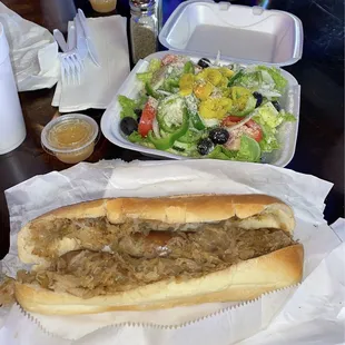 Bratwurst and sauerkraut hoagie, house salad