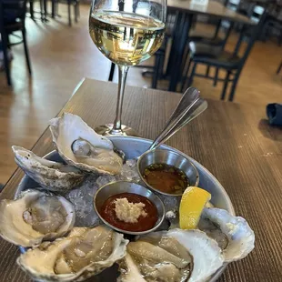 Half dozen oysters and house white wine - sauvignon blanc and chardonnay blend (I believe)