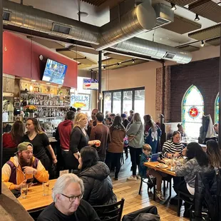 a large group of people sitting at tables