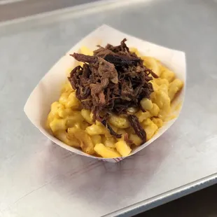 Chopped brisket on top of Mac and cheese!