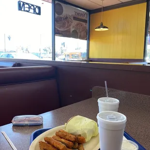 a plate of fried chicken and a cup of milk