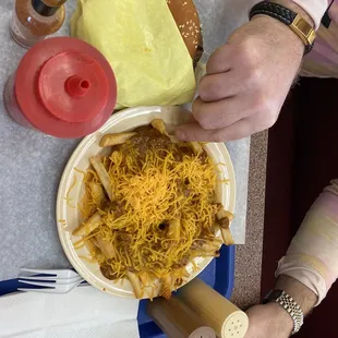 a plate of cheese fries