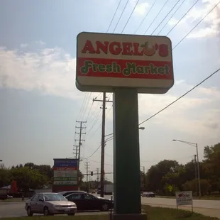 a sign for a fresh market