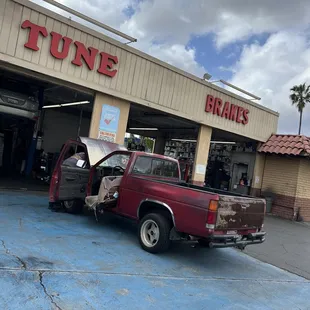 a truck parked in front of a store