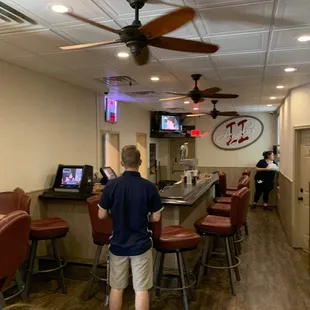 a man standing at the bar