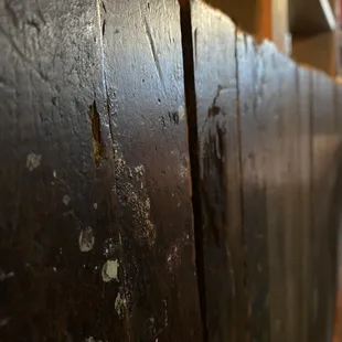 The old woodwork tht it inside the restaurant and beside the tables