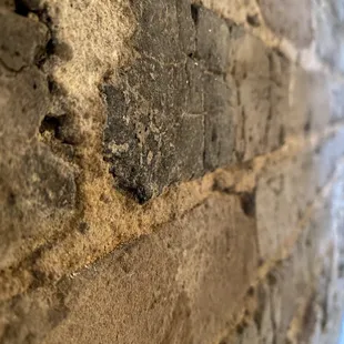 The brick work inside the restaurant and besides the tables. Beautiful