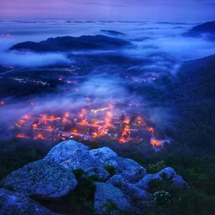 a view of a city in the fog