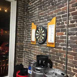 a brick wall with a dart on it