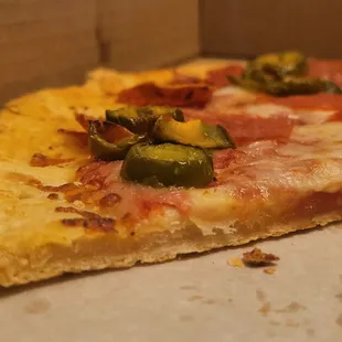 As you can see from the photo, the pizza dough has no rise. Looks like it was run over.