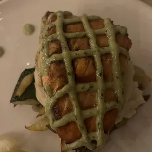 Salmon over a bed of vegetables