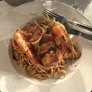Shrimp and scallops with shiitake mushrooms over fettuccine with a spicy marinara sauce