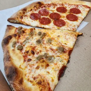 Slice of pepperoni and slice of sausage pizza