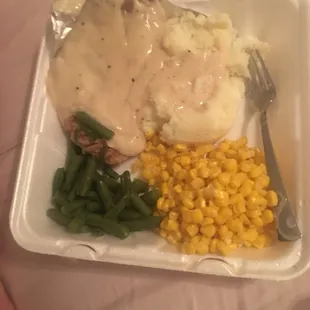 a meal in a styrofoam container